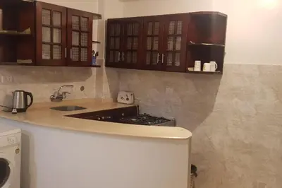 a kitchen with a sink and a counter top at Elminaa Residents 3 in Luxor