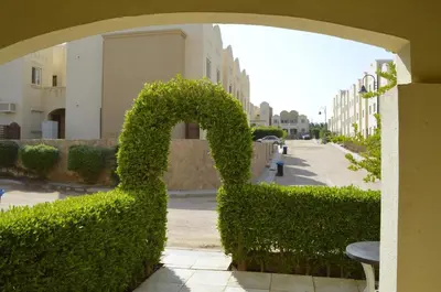 a bush shaped like a swan on a street at Nice 2-Bed Apartment in Hurghada