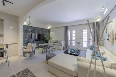 a living room with a couch and a table at Stylish Nest - New Marina - El Gouna in Hurghada