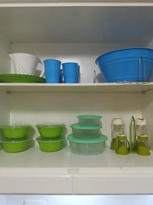 a bunch of bowls and plates on shelves at Turtles Beach Resort in Hurghada