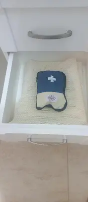 a drawer with a tray on the bottom of a bed at Turtles Beach Resort in Hurghada