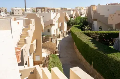 a view of a street in a city with white buildings at Beautiful 2-Bed Villa in Makadi Heights in Hurghada