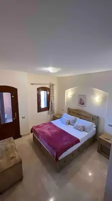 a bedroom with a large bed in a room at Vue magnifique, confort unique in Hurghada