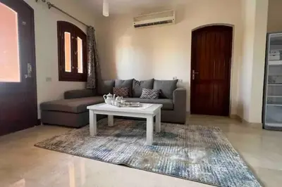 a living room with a couch and a coffee table at Vue magnifique, confort unique in Hurghada