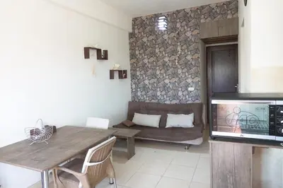 a living room with a table and a couch at Captivating 1-Bed Apartment in hurghada in Hurghada