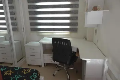 a white desk with a black chair in a room at Captivating 1-Bed Apartment in hurghada in Hurghada