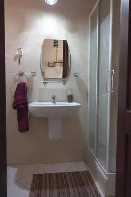a bathroom with a sink and a shower at Captivating 1-Bed Apartment in hurghada in Hurghada