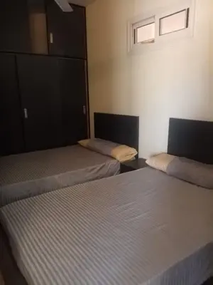 two beds in a room with two beds sidx sidx sidx at Family-friendly apartments in Hurghada in Hurghada