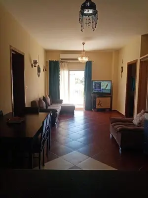 a living room with a couch and a table at Family-friendly apartments in Hurghada in Hurghada