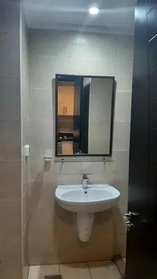 a bathroom with a sink and a mirror on the wall at Hurghada Aldau Heights Studio in Hurghada
