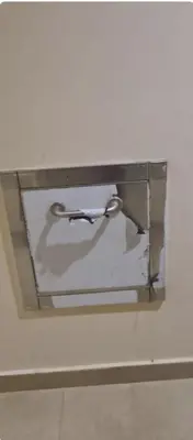 a glass shelf with a wire in a white wall at Hurghada Aldau Heights Studio in Hurghada