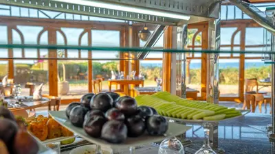 a display of vegetables on a table in a restaurant at Three Corners Equinox Beach Resort in Abu Dabab