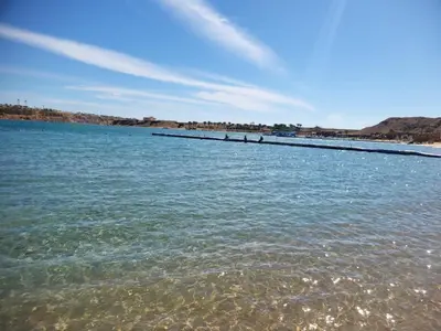 a long pier in the water on a beach at Relax Home 1 in Hurghada