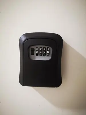 a black remote control sitting on a wall at Relax Home 1 in Hurghada