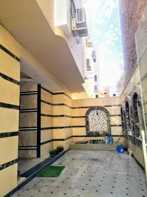 a building with a wall with stripes on it at Relax Home 1 in Hurghada
