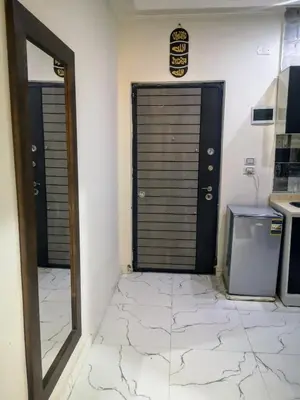 a room with two doors and a tile floor at Relax Home 1 in Hurghada