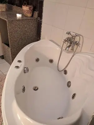 a white bath tub in a bathroom at Aswan Nile view Family apartment in Aswan