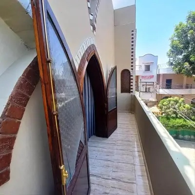 a door on the side of a building at Villa Giulio - Guest House in Luxor