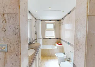 a bathroom with a sink and a toilet and a tub at Stylish Apartment 3 Brooms MB1at Marina Abu-Tig with Marina View in Hurghada