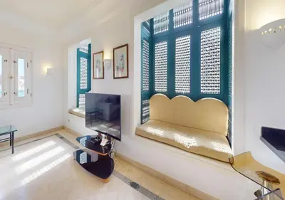 a living room with a bench and a window at Stylish Apartment 3 Brooms MB1at Marina Abu-Tig with Marina View in Hurghada