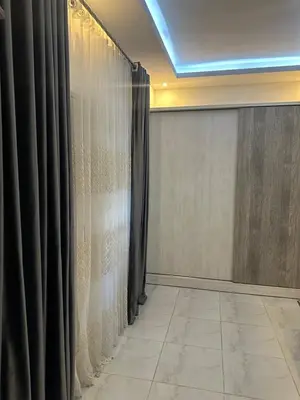 a room with curtains and a tiled floor at Horizon on Mamsha 2 in Hurghada