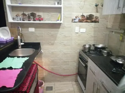 a small kitchen with a stove and a sink at Apartment in Cecelia Resort in Hurghada