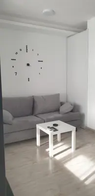 a white coffee table in a living room with a couch at Studio In sky el Gandoul compound in Hurghada