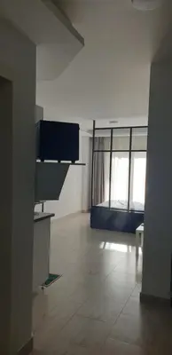 an empty room with two windows in a building at Studio In sky el Gandoul compound in Hurghada