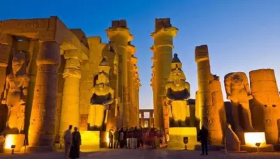 a group of people standing in front of a temple at Nile Cruise from Aswan to Luxor 3 Night And Luxor to Aswan 4 Night in Jazīrat al ‘Awwāmīyah