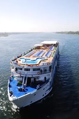 a large cruise ship in a large body of water at Nile Cruise from Aswan to Luxor 3 Night And Luxor to Aswan 4 Night in Jazīrat al ‘Awwāmīyah