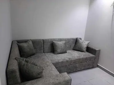 a couch in a room with a white wall at Scandic Resort in Hurghada