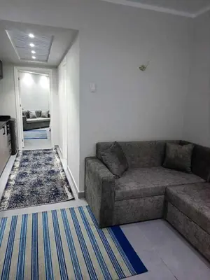 a living room with a couch and a rug at Scandic Resort in Hurghada