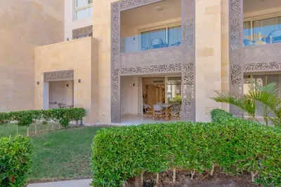 a villa with a view of the courtyard at Ground Floor 2BR Apt in Mangroovy, Pool & Beach in Hurghada