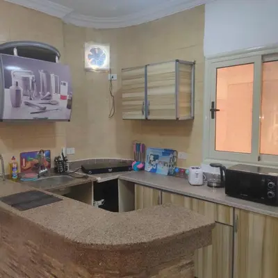 a kitchen with a sink and a counter top at Oscar luxury free WiFi 15 in Hurghada