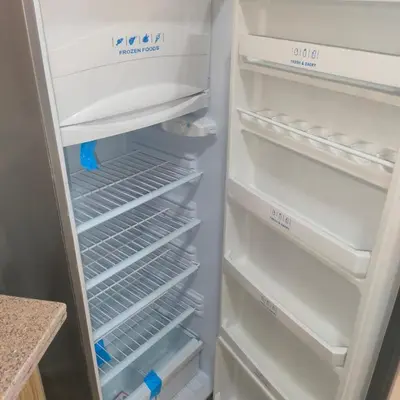 an empty refrigerator with its door open with the door open at Oscar luxury free WiFi 15 in Hurghada