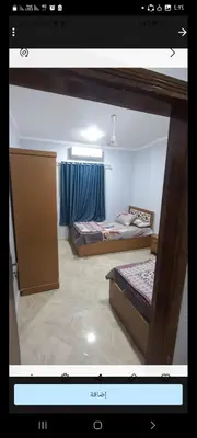 a picture of a room with two beds in it at Ikea flat 9 in Hurghada