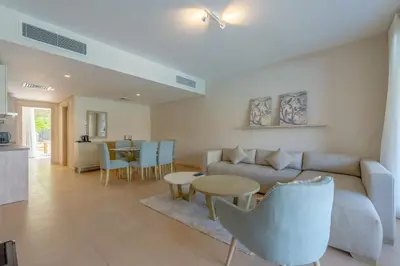 a living room with a couch and a table at Pool Front 2BR in Mangroovy - El Gouna, Beach Access in Hurghada