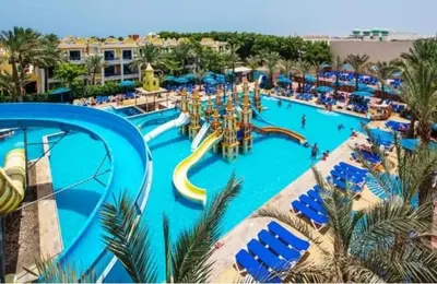a large swimming pool with a water park at Apartment 2 bedroom and 2 Bathroom pool view at mirage bay in Hurghada