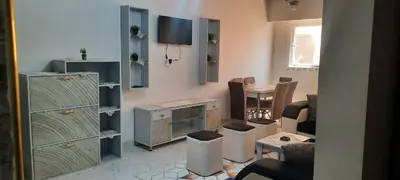 a room with a living room with a dining room at New Apartment for short and long term in Hurghada