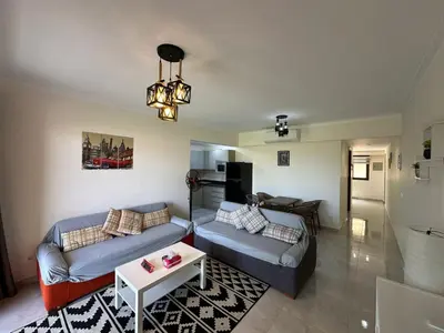 a living room with two couches and a table at The View Club House in Hurghada