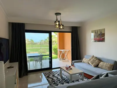 a living room with a couch and a table at The View Club House in Hurghada