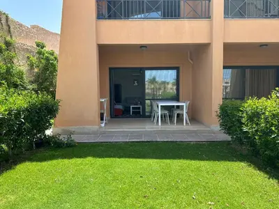 a house with a patio with a table and chairs at The View Club House in Hurghada