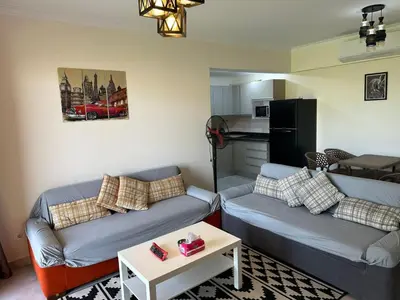 a living room with two couches and a table at The View Club House in Hurghada