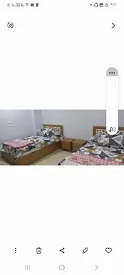a room with two tables with clothes on them at Ikea flat 10 in Hurghada