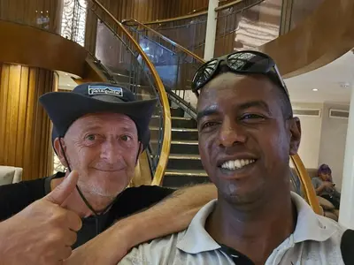 two men standing next to each other with a hat at Five Star Nile Cruise from Aswan to Luxor in Aswan
