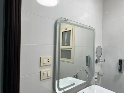 a bathroom with a mirror and a sink at S 22 Marina City in Port Ghalib