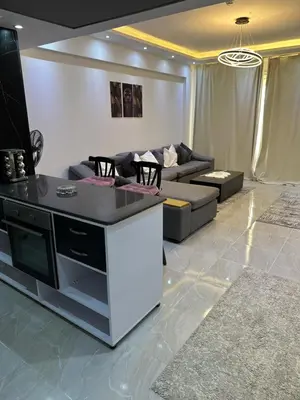 a living room with a couch and a table at S 22 Marina City in Port Ghalib