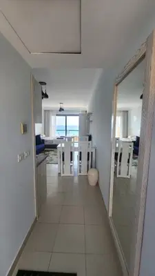 a hallway leading to a kitchen and a dining room at Studio in old Sheraton in Hurghada