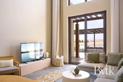 a living room with a couch and a flat screen tv at BYTK - Casamigos in Hurghada