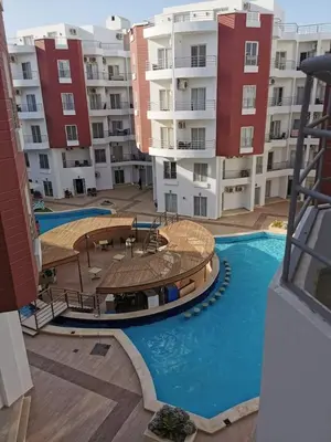 a view of an apartment complex with a swimming pool at Fabulous studio 8 mins drive to El Gouna gates in Hurghada